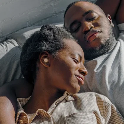 Couple relaxing together in bed